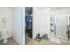 Bathroom with a toilet, tiled floor, and a glass-enclosed shower and a view into the closet at 3679 Julius Estates Blvd, Winter Haven, FL 33881