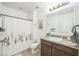 Bathroom featuring a shower with white shower curtain, a vanity with dark cabinets, and a white toilet at 3679 Julius Estates Blvd, Winter Haven, FL 33881