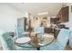 Bright kitchen featuring a glass-top table set for four, a stainless fridge and dark wood cabinets at 3679 Julius Estates Blvd, Winter Haven, FL 33881