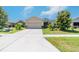 Inviting single-Gathering home boasting a large driveway and a neatly landscaped front yard at 3679 Julius Estates Blvd, Winter Haven, FL 33881