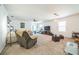 Spacious living room bathed in light, complete with plush seating, TV, and stylish decor at 3679 Julius Estates Blvd, Winter Haven, FL 33881