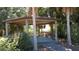 Charming wooden pavilion surrounded by trees and greenery, with distant water views at 3679 Julius Estates Blvd, Winter Haven, FL 33881