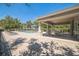 Community pool and patio area featuring lounge chairs, covered seating, and a brick-paved deck at 3679 Julius Estates Blvd, Winter Haven, FL 33881