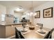 Comfortable dining space features modern lighting and seating for four near kitchen at 4504 Alberto Cir, Kissimmee, FL 34746