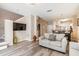 Comfortable living room with wood floors and easy access to kitchen, dining, and stairs at 4504 Alberto Cir, Kissimmee, FL 34746