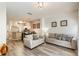 Comfortable living room with wood floors and easy access to kitchen and dining at 4504 Alberto Cir, Kissimmee, FL 34746