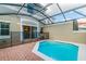 This backyard features an enclosed pool and patio, offering a private and secure outdoor retreat at 4504 Alberto Cir, Kissimmee, FL 34746