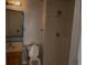 Bathroom with a toilet, sink, bathtub, and shower at 459 Danube Dr, Poinciana, FL 34759