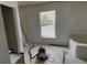 Bathroom features a soaking tub beneath a window for natural light and relaxation at 459 Danube Dr, Poinciana, FL 34759