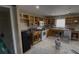 Partially renovated kitchen featuring a window, exposed cabinets and appliances ready for your design vision at 459 Danube Dr, Poinciana, FL 34759