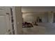 Spacious living room featuring a doorway to the outside and featuring neutral walls and concrete flooring at 459 Danube Dr, Poinciana, FL 34759