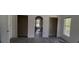 Bright living room featuring modern grey flooring, fresh white walls, and an open, airy layout at 459 Danube Dr, Poinciana, FL 34759