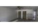 Spacious living room with new floors, fresh paint, ceiling fan, and closet space at 459 Danube Dr, Poinciana, FL 34759