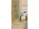Modern bathroom featuring a glass-enclosed shower and white marble flooring at 461 Fish Hawk Dr, Winter Haven, FL 33884