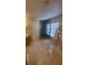 Bathroom with white marble tiling, glass enclosed shower, and soaking tub at 461 Fish Hawk Dr, Winter Haven, FL 33884