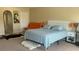 Bright bedroom features neutral walls, a king bed and decor at 461 Fish Hawk Dr, Winter Haven, FL 33884
