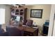 Stylish home office featuring a large desk, a leather chair, and a built-in bookcase at 461 Fish Hawk Dr, Winter Haven, FL 33884