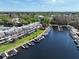 Aerial view shows marina and condo complex, with boat docks, green space, and easy water access for residents at 6084 Masters Blvd, Orlando, FL 32819