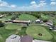 Aerial view of golf course event featuring stage, tents, and meticulously kept greens at 6084 Masters Blvd, Orlando, FL 32819