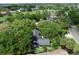 Aerial view of house with green tree coverage and outlined in yellow property lines at 6084 Masters Blvd, Orlando, FL 32819
