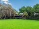 Expansive backyard with mature trees, lush lawn, and serene surroundings, perfect for outdoor enjoyment at 6084 Masters Blvd, Orlando, FL 32819