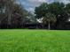 Spacious backyard with mature trees and lush greenery, offering a serene and private outdoor retreat at 6084 Masters Blvd, Orlando, FL 32819