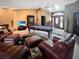 Inviting living room with a fireplace, pool table, and comfortable seating, perfect for relaxation and entertainment at 6084 Masters Blvd, Orlando, FL 32819