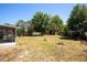 Large backyard with mature trees, perfect for outdoor activities and relaxation at 730 Georgia Ave, Longwood, FL 32750