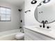 Bathroom with a shower-tub, neutral tiles, and a white vanity at 730 Georgia Ave, Longwood, FL 32750