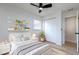 Bedroom with white walls, wood floors, a fan, and a closet at 730 Georgia Ave, Longwood, FL 32750