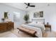 Stylish main bedroom with lots of natural light, hardwood floors, and decorative touches at 730 Georgia Ave, Longwood, FL 32750