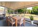 Screened-in patio with a grill and outdoor dining set, offering a relaxing outdoor space at 730 Georgia Ave, Longwood, FL 32750