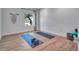 Bonus room features hardwood floors, neutral walls and yoga mats at 804 E 24Th Ave, New Smyrna Beach, FL 32169