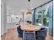 Bright dining area with modern table set and stylish pendant lighting next to kitchen at 804 E 24Th Ave, New Smyrna Beach, FL 32169