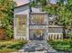 Inviting modern two-story home featuring a balcony and manicured front lawn at 804 E 24Th Ave, New Smyrna Beach, FL 32169