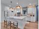 Bright, modern kitchen with a large island, stainless appliances, and ample storage at 804 E 24Th Ave, New Smyrna Beach, FL 32169