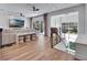 Open-concept living room with modern furniture, a flat-screen TV, and glass doors to the outside at 804 E 24Th Ave, New Smyrna Beach, FL 32169