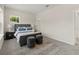 Bright bedroom featuring carpet floors, two windows, and stylish decor at 805 S Locust Ave, Sanford, FL 32771