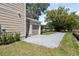 A two-story home features a garage and a beautiful brick driveway with mature landscaping at 805 S Locust Ave, Sanford, FL 32771