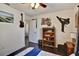 Bedroom with ceiling fan, closet, dark wood floors and decorated walls at 8111 Pacific Loon St, Winter Garden, FL 34787