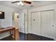 Bedroom featuring dark wood floors, closet and a ceiling fan at 8111 Pacific Loon St, Winter Garden, FL 34787