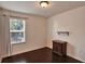 Cozy bedroom featuring dark wood floors, dresser and window at 8111 Pacific Loon St, Winter Garden, FL 34787