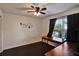 Bedroom featuring a window, ceiling fan and dark wood floors at 8111 Pacific Loon St, Winter Garden, FL 34787
