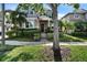 Inviting two-story home with a well-manicured lawn, lush landscaping, and covered entryway with decorative touches at 8111 Pacific Loon St, Winter Garden, FL 34787