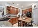 Well-equipped kitchen with a central island, ample counter space, and stylish dark wood cabinets at 8111 Pacific Loon St, Winter Garden, FL 34787