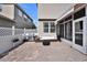 Paver patio with awning, stainless grill, and outdoor sofa at 8111 Pacific Loon St, Winter Garden, FL 34787