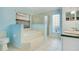 Serene bathroom featuring a soaking tub, a glass-enclosed shower, and double vanities with modern fixtures at 847 Coventry Rd, Davenport, FL 33897
