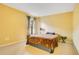 Cozy bedroom featuring neutral walls, plush carpeting, and a side table at 847 Coventry Rd, Davenport, FL 33897