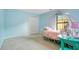 Whimsical bedroom with themed bed frame, plush carpet, and bright blue walls at 847 Coventry Rd, Davenport, FL 33897