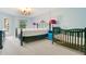 Spacious bedroom featuring an ornate bed frame, complementing side tables, and access to outdoor views at 847 Coventry Rd, Davenport, FL 33897